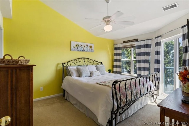 carpeted bedroom with ceiling fan and lofted ceiling