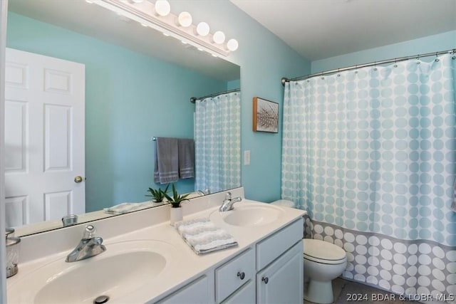 bathroom with tile patterned flooring, toilet, vanity, and a shower with shower curtain