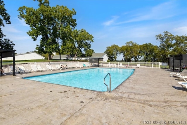 view of swimming pool with a patio area