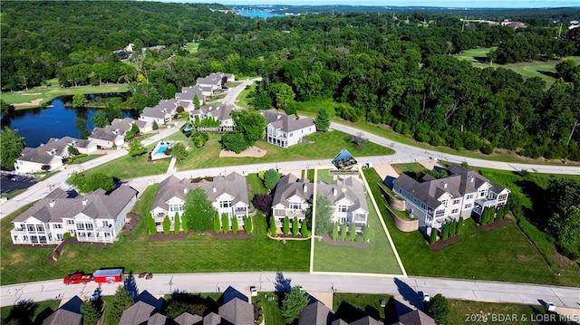 bird's eye view with a water view