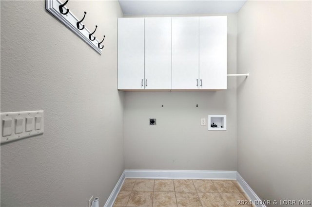 laundry room featuring hookup for an electric dryer, hookup for a gas dryer, cabinets, and hookup for a washing machine