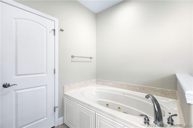 bathroom featuring a tub to relax in