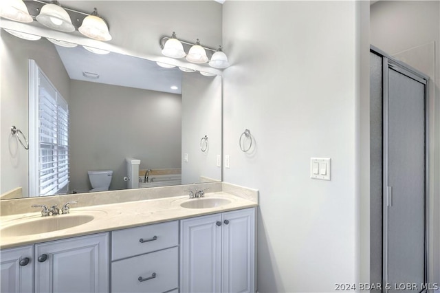 bathroom with vanity and toilet