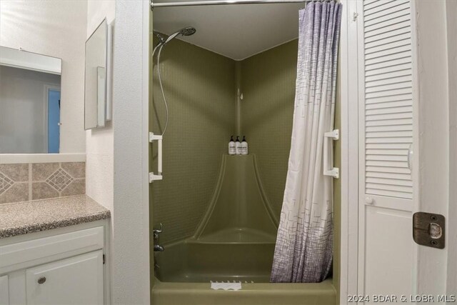 1465 Easy St, Osage Beach, MO 65065 - full bathroom with shower / bath combo, decorative backsplash, and vanity