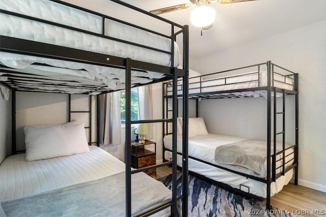 bedroom featuring ceiling fan and hardwood / wood-style flooring