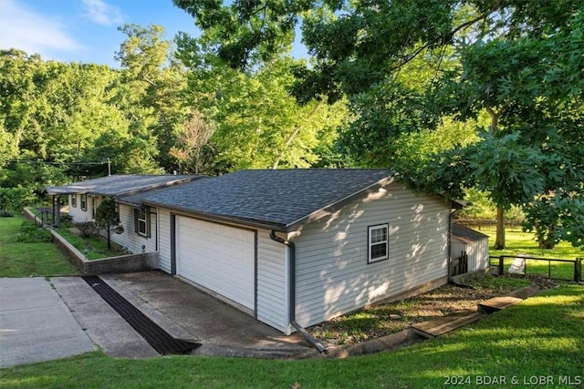 garage featuring a yard