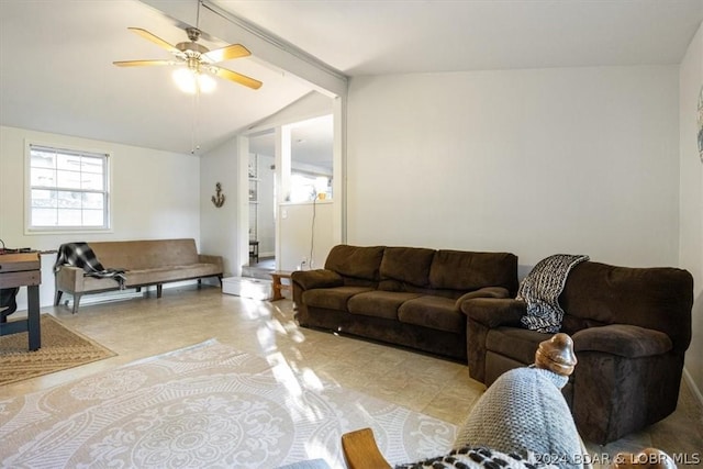 living room with ceiling fan and vaulted ceiling with beams