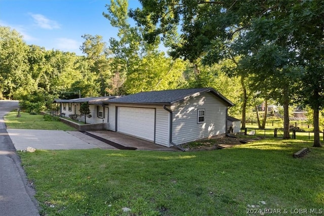 garage with a yard