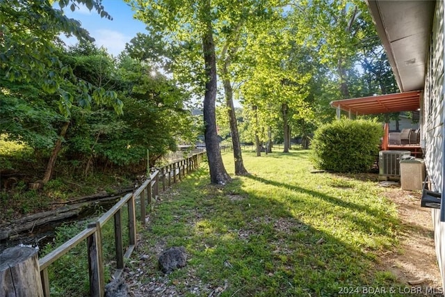 view of yard with central AC