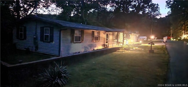 view of property exterior at dusk