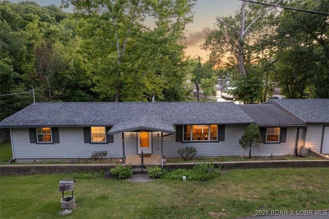 1465 Easy St, Osage Beach, MO 65065 - ranch-style home featuring a lawn and a shingled roof