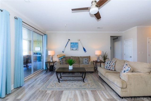 living room with ceiling fan, light hardwood / wood-style floors, and crown molding