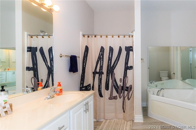 full bathroom featuring plus walk in shower, vanity, wood-type flooring, and toilet