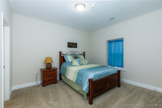 bedroom with light carpet