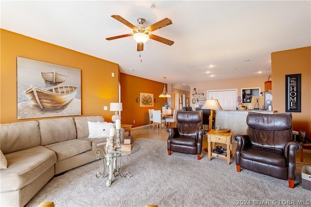 living room featuring light carpet and ceiling fan