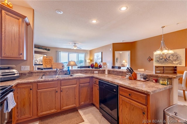 kitchen with kitchen peninsula, decorative light fixtures, black appliances, sink, and light tile patterned floors