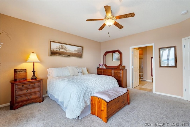 carpeted bedroom featuring ensuite bathroom and ceiling fan