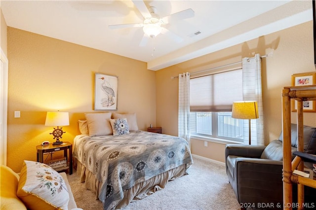 bedroom with light carpet and ceiling fan