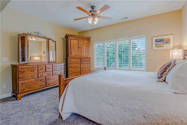 bedroom with ceiling fan and carpet