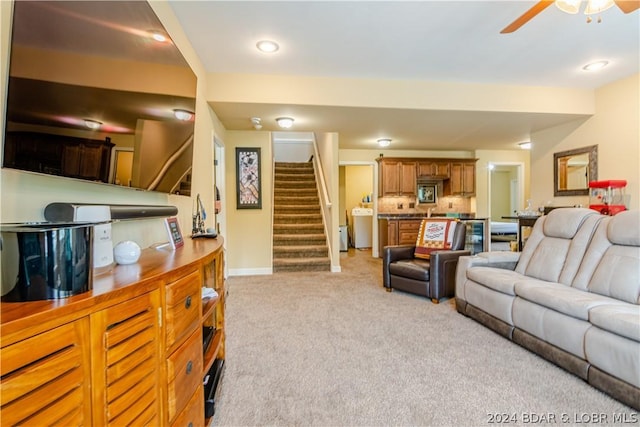 carpeted living room featuring ceiling fan