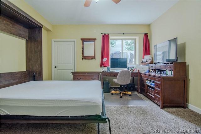 bedroom featuring light colored carpet and ceiling fan