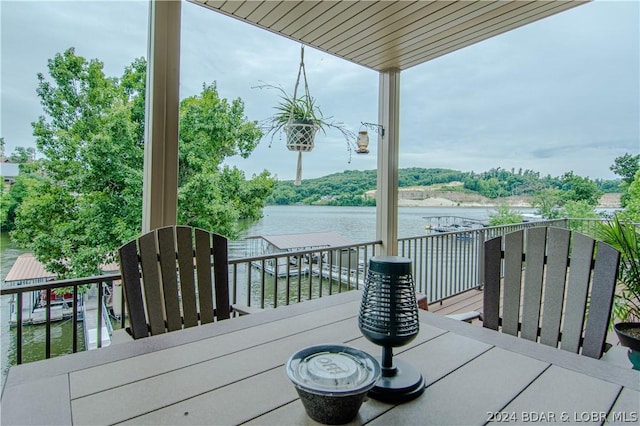 wooden terrace with a water view