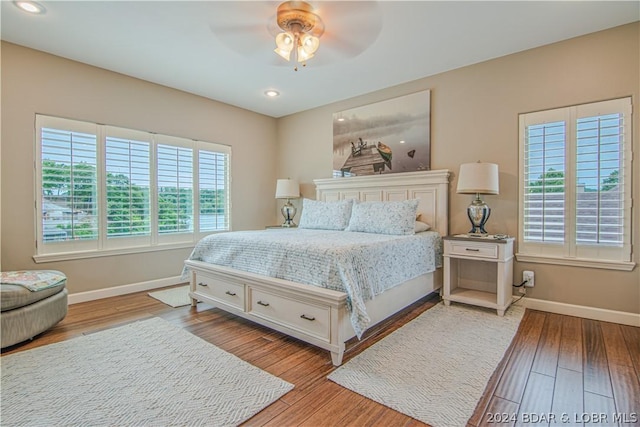 bedroom featuring ceiling fan and hardwood / wood-style floors