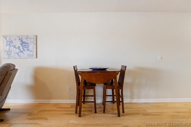 dining area with light hardwood / wood-style flooring