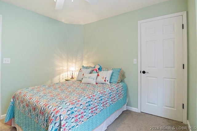 carpeted bedroom with ceiling fan