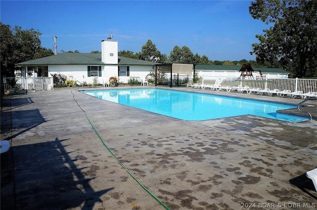 view of swimming pool with a patio area