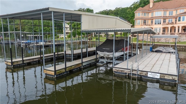 view of dock featuring a water view and boat lift