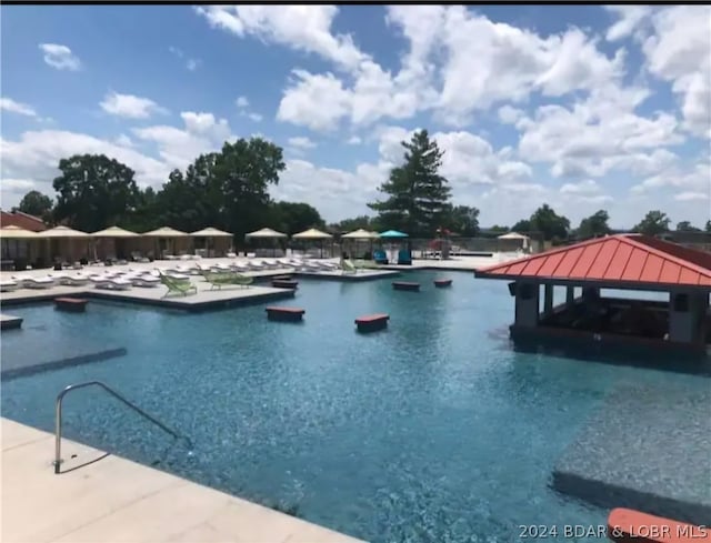 view of swimming pool featuring a gazebo