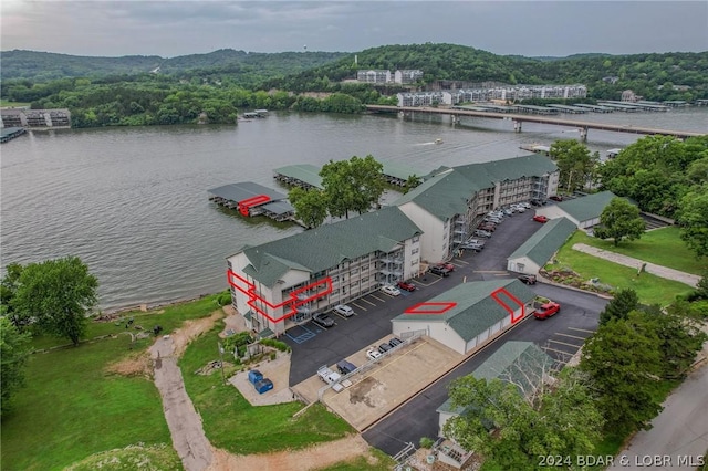 birds eye view of property with a water view