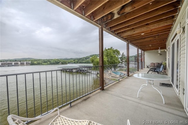 balcony featuring a water view