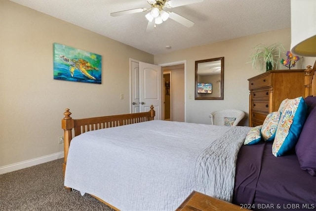 bedroom featuring ceiling fan, carpet flooring, and a textured ceiling