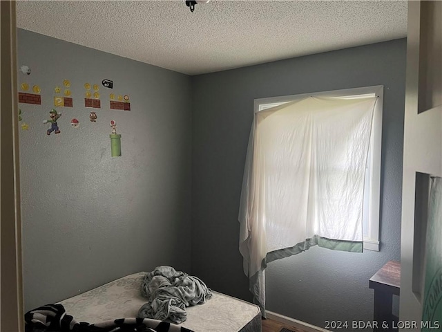 bedroom featuring a textured ceiling