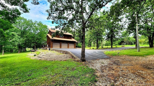 view of property's community with a lawn