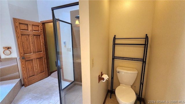 bathroom with toilet and walk in shower