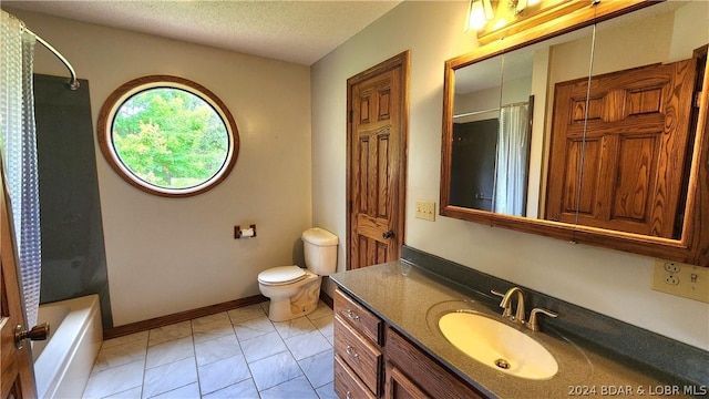 full bathroom with shower / bathtub combination with curtain, vanity, toilet, and a textured ceiling