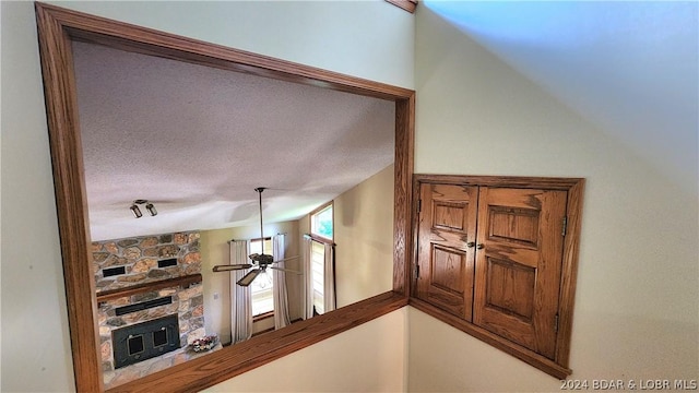 corridor featuring a textured ceiling