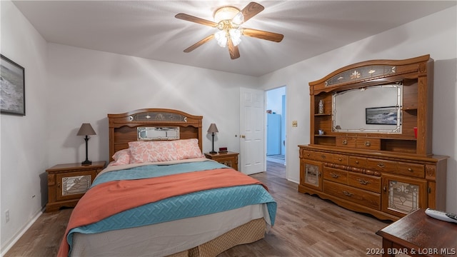 bedroom with hardwood / wood-style floors and ceiling fan