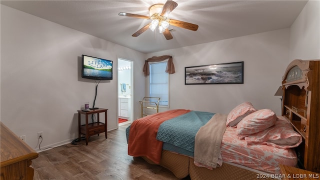 bedroom with ceiling fan, dark hardwood / wood-style flooring, and connected bathroom