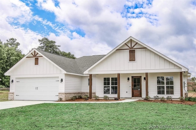 view of front facade with a garage and a front lawn