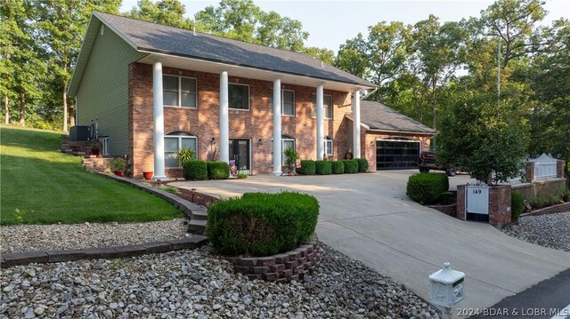 view of front of home with a garage and a front yard