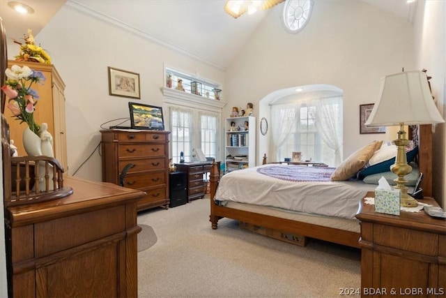 carpeted bedroom featuring high vaulted ceiling