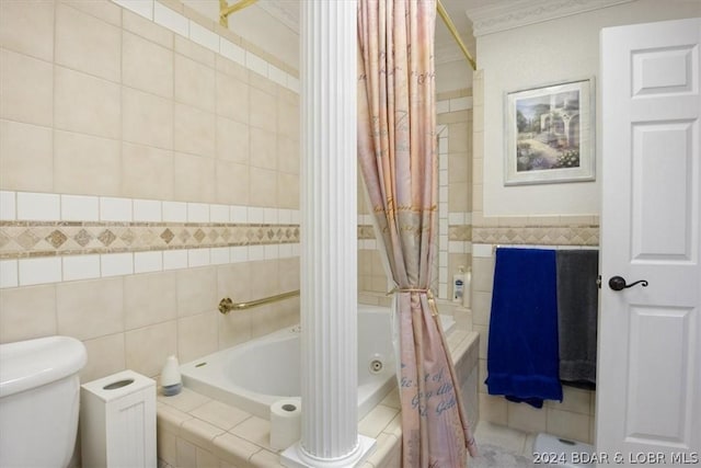 bathroom with tile walls, ornamental molding, toilet, and shower / bath combo