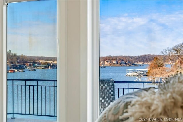 balcony featuring a water view