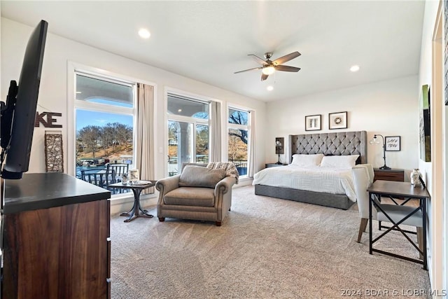 carpeted bedroom with ceiling fan and access to outside