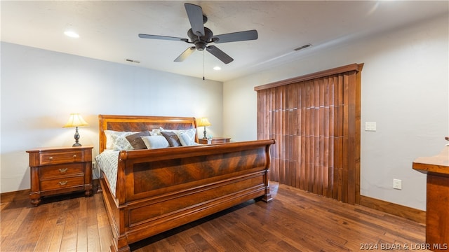 bedroom featuring ceiling fan and dark hardwood / wood-style flooring