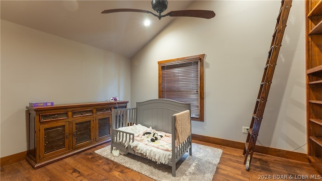 bedroom featuring ceiling fan, hardwood / wood-style flooring, and lofted ceiling